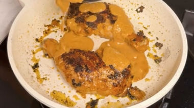 Creamy Iffa chicken coated in rich garlic cheese sauce and garnished with coriander